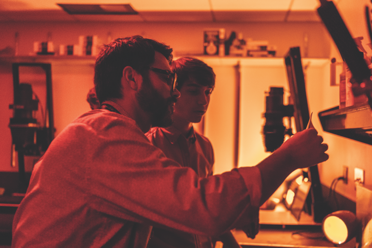 Art teacher with upper school student in photography lab